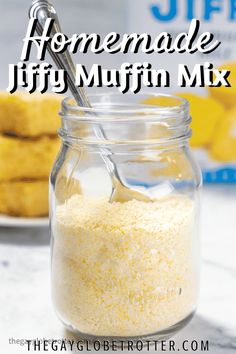 homemade jiffy muffin mix in a jar with a spoon and cookies behind it