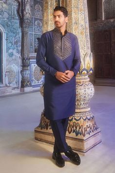 Dark blue full sleeves kurta crafted in cotton silk with metallic quad cutdana embroidery on the yoke and mandarin collar neckline. Paired with a pant. - Aza Fashions Blue Jamawar Lawn Suit For Festivals, Traditional Blue Salwar Kameez With Naqshi, Blue Jamawar Kurta For Festivals, Blue Traditional Wear With Naqshi For Eid, Festive Blue Jamawar Kurta, Traditional Blue Kurta With Naqshi, Traditional Blue Jamawar Lawn Suit, Blue Ceremonial Kurta, Blue Lawn Suit With Naqshi For Diwali