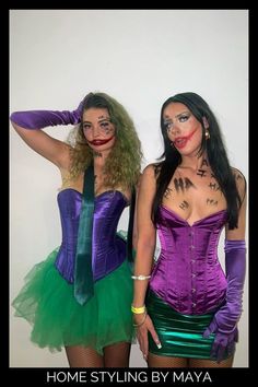 two women dressed in costumes posing for the camera