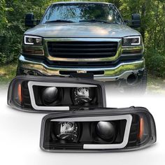 an image of a pair of headlights for the front end of a truck with trees in the background