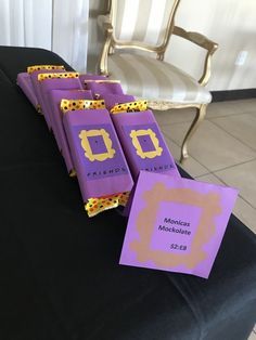 purple and yellow candy bags sitting on top of a table