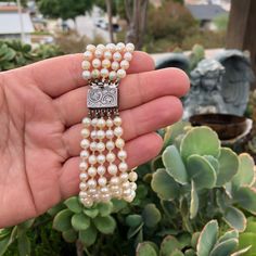 "Antique Victorian Era Five Strands of Old Graduating Pearls Beaded Bracelet with 800 Sterling Silver Ornate Details Slide Lock Clasp, 8 Inches Long.  Overall in good-fair aged condition, old pearls shows surface wears and \"flaws\" in some areas, some have been chipped and looks of peeling. You can tell this piece has been heavily worn, or been through a lot (Lol). Still gorgeous and definitely wearable, does not need to be re-threaded in my opinion.  -Bracelet full wear length measures 8 Inches, Diameter of Graduating pearls, smallest measures 4.7mm, largest measures 7.9mm - Clasp is marked \"800\" and \"GEO\" - Bracelet total weighs 40.9 Grams *Box and props in the picture are not included in this listing, only the bracelet! Thank you. Please feel free to ask any questions! ┊  ┊  ┊  ┊ ┊ Luxury Beaded Pearl Bracelet For Formal Occasions, Luxury Beaded Pearl Bracelet, Luxury Beaded Pearl Bracelet For Wedding, Luxury Beaded Bracelets With Round Beads For Wedding, Elegant Beaded Bracelet With Sterling Silver Clasp, Elegant Beaded Bracelets With Sterling Silver Clasp, Luxury Round Beaded Bracelets For Wedding, Formal Single Strand Beaded Bracelet With Round Beads, Luxury Wedding Bracelets With Round Beads