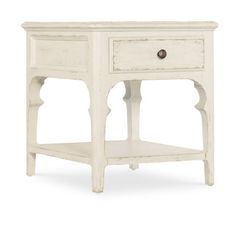 an old white wooden table with drawers on one side and a drawer on the other