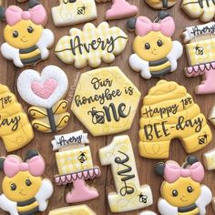 decorated cookies are arranged on a table with words and pictures in the shape of honeybees