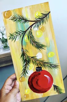 a painting of a christmas ornament hanging from a pine tree