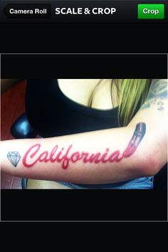 a woman with a tattoo on her arm that says california