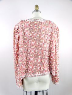 "This is a STUNNING and RARE vintage piece heavily embellished with iridescent pink sequins and beading. It's in perfect condition! Bust - 42\" (with the front brought together) Shoulders - 18\" Sleeves - 24\" Length - 23\" All of my items come from a smoke-free and pet-free home. If you have any questions, please don't hesitate to ask!" Pink Semi-stitched Embellished Blouse Piece, Festive Pink Sequin Fabric With Contrast Sequin, Spring Embellished Multicolor Sequin Fabric, Pink Embellished Sequin Fabric, Glamorous Style, Vintage Sequin Fitted Outerwear, Embellished Blazer, Checkered Jacket, Sequin Jacket, Pink Sequin