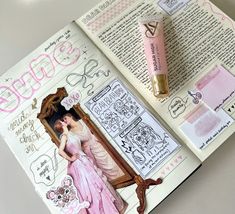 an open book with some pink and white designs on it's pages, next to a pair of eyeliners