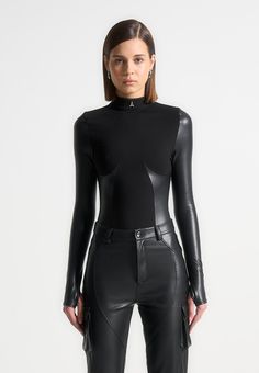 Black High Neck Long Sleeve Bodysuit Perfect for evenings out, this bodysuit sculpts the body perfectly using the vegan leather underbust contour panelling. The vegan leather sleeves mould the arms to create slim, elongated arms. Thong Bodysuit Silhouette Bandage Main Body Vegan Leather Contouring Vegan Leather Sleeves Fall 24, Leather Sleeves, Leg Sleeves, Bodysuit Black, High Neck Long Sleeve, Leather Sleeve, Leather Outfit, Womens Bodysuit, Black Bodysuit