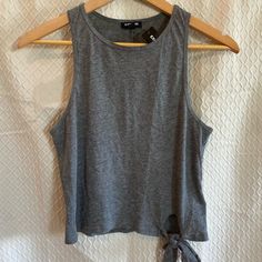 Express Sleeveless Summer Tank. Tie Front Embellishment. Gray. Medium. New With Tags. Lightweight Breathable Design. This Piece Is Formfitting And Very True To Size. It Almost Runs Slightly Small. Modestly Cropped. A Wonderful Casual Piece To Add To Your Summer Collection. Pair With Your Favorite High Waisted Shorts. Light; Breathable; Racerback; Thin; Crop; Tank Top Cell Phone Holster, Phone Holster, Summer Tank, Crop Tank Top, Walker Boots, Fit N Flare Dress, Rain And Snow Boots, Boot Sandals, Crop Tank