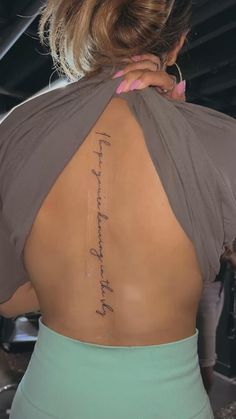 the back of a woman's neck with a tattoo that reads, i love you to