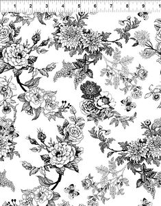 a black and white floral pattern with flowers on the side, in front of a ruler