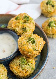 broccoli patties with ranch dip in a bowl on a table next to napkins