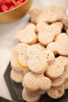 some heart shaped cookies are on a black plate