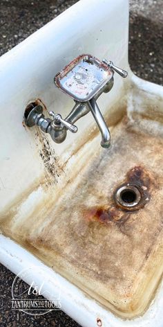 an old sink that has been turned into a faucet with rust on it