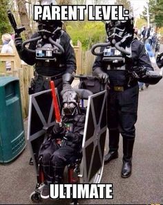 two people dressed as darth vader in costumes