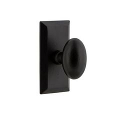 a black door handle with a round knob on an isolated white background for use in interior or exterior doors