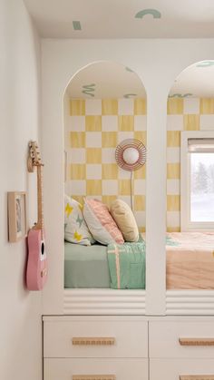 a bedroom with yellow and white checkered wallpaper on the walls next to a bed