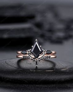 a black diamond ring on top of a table