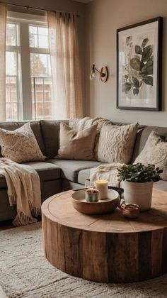 a living room filled with furniture and a coffee table in front of a large window