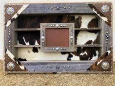 a cow hide with metal rivets and studded accents