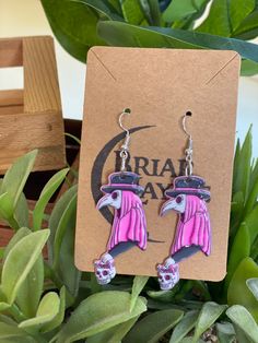 Pastel Goth Pink Witch Doctor Earrings | Pastel Goth Skeleton Earrings | Halloween Earrings | Gothic Earrings | Pastel Goth Earrings | voodoo earrings | Shaman Earrings | Medicine Man Earrings | Ritual Earrings    Who doesn't love earrings! Earrings make a small and simple yet powerful fun statement for any look! What a special timeless gift for any loved one. We offer so many different designs and themes. Weather your looking for food, animals, nature, movies, etc. We have you covered and have something to meet everyone's needs. Weather it's Christmas, Birthdays or just a little something to surprise your loved one with our earrings are the perfect unique special gift!    Disclaimer:  -Our earrings are not stainless steel -We do not accept refunds at this time unfortunately. -Shipping tim Doctor Earrings, Pastel Goth Earrings, Goth Skeleton, Nature Movies, Man Earrings, Pink Witch, Pastel Punk, Medicine Man, Earrings Gothic