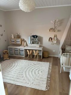 a baby's room is decorated in neutral colors