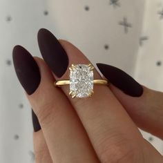 Our elongated cushions have a minimum ratio of 1.4 and are therefore longer and slimmer than most others. This makes them appear larger and more sophisticated. They are considered to be rarer, more valuable, and more desirable. This exquisite engagement ring showcases a 4-carat elongated cushion-cut lab-grown diamond, securely set with four double-claw prongs for a refined and elegant look. A hidden halo adds a subtle touch of brilliance, enhancing the center stone's radiance. Meticulously craft Elongated Cushion Engagement Ring Gold, Cushion Engagement Ring Gold, Elongated Cushion Engagement Ring, Engagement Ring Double, Moissanite Engagement Ring Cushion Cut, Elongated Cushion Cut, Engagement Ring Gold, Hidden Halo Engagement Ring, Cute Engagement Rings