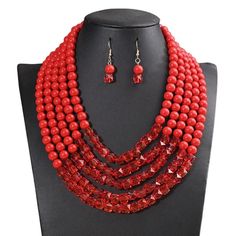 Ignite your look with the fiery elegance of this red acrylic bead necklace and earring set. Crafted with precision, this multi-strand necklace boasts a bold red hue that exudes confidence and style. Accompanied by matching earrings, this set is a testament to timeless beauty and a striking addition to any jewelry collection. Necklace Length: 42 cm / 16.5 in Earring Length: 4.2 cm / 1.65 in Weight: 153 g / 5.4 oz Designed with comfort in mind, the necklace is secured with an adjustable clasp, off Red Crystal Beaded Necklaces For Party, Red Crystal Beaded Necklace For Party, Red Crystal Beaded Necklaces With Round Beads, Red Crystal Round Bead Jewelry, Red Faceted Beads Jewelry For Party, Red Crystal Beaded Necklace With Round Beads, Elegant Red Crystal Beaded Necklaces, Red Crystal Round Bead Necklaces, Red Crystal Round Bead Necklace