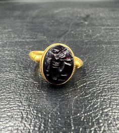 Ancient garnet with 18k gold seal ring Formal Gold Cabochon Signet Ring, Gold Ruby Signet Ring With Polished Finish, Antique Ruby Signet Ring, Gold Ruby Signet Ring For Formal Occasions, Antique Ruby Signet Ring For Formal Occasions, Gift Yellow Gold Cabochon Signet Ring, Antique Hallmarked Ruby Signet Ring, Antique Yellow Gold Ruby Ring With Polished Finish, Luxury Ruby Signet Ring For Formal Occasions