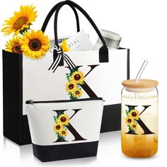 two bags with sunflowers on them next to a mason jar filled with liquid