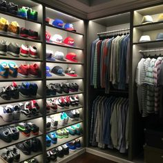 a closet filled with lots of shoes and hats on shelves next to a wall mounted light