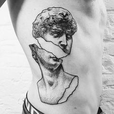 a woman's stomach with a drawing of two faces on the lower part of her body