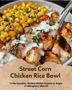 chicken rice bowl with corn on the cob and ranch dressing in a white bowl