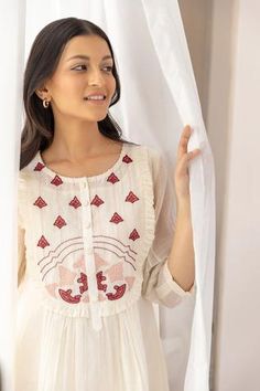 Off-white chanderi kurta with red applique embroidered floral motifs on yoke. Paired with pleated pant and inner.
Component: 3
Pattern: Embroidery
Type Of Work: Floral
Neckline: Round
Sleeve Type: Three quarter
Fabric: Chanderi, cotton
Color: White
Other Details: 
Front button detailing
Beaded hem
Occasion: Puja - Aza Fashions Festive Chanderi Kurta With Yoke Detail, White Chanderi Dress With Embroidered Border, Traditional White Embroidered Top For Festive Occasions, Traditional White Embroidered Festive Top, White Embroidered Festive Top, White Cotton Traditional Wear With Dori Work, White Chanderi Traditional Wear For Summer, Summer White Chanderi Traditional Wear, Festive White Chikankari Embroidered Top