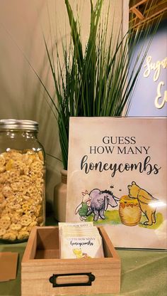 a wooden box filled with cereal next to a sign