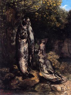 an image of two dead animals in the woods