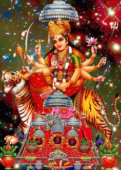 the hindu goddess sitting on top of a tiger