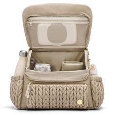 an open diaper bag with items in it