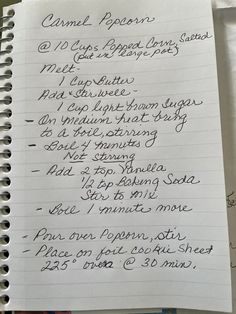 a handwritten recipe list on top of a spiral - bound notebook with writing in cursive ink