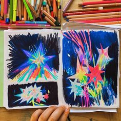 someone is drawing stars on paper with colored pencils