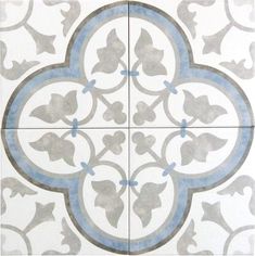 a white and blue tile with an intricate design