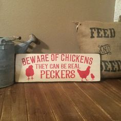 there is a sign that says beware of chickens they can be real peckers