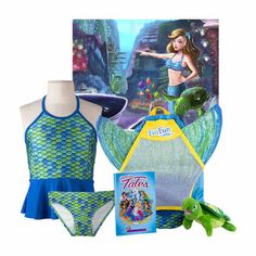 the little mermaid swimsuit is on display in front of a card with an image of ariel