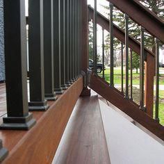 the railings are made of wood and metal