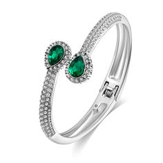 PRICES MAY VARY. Elevate your style with our silver open cuff bracelet adorned with two striking green rhinestones encircled by a halo of brilliant white rhinestones. Experience the allure of sparkling gemstones that command attention. The bangle bracelet measures 2.6 in and weighs 1 oz/pc. The contrasting play between the vivid green centerpiece and the glistening white accents makes this green bracelet a true statement piece. Its harmonious blend of colors adds a touch of sophistication to any Silver Bangle Bracelet For May Birthstone, Green Bangle Cuff Bracelet For Party, Elegant Silver Crystal Bracelet For May Birthstone, Green Bangle Crystal Bracelet For Formal Occasions, Green Crystal Bangle Bracelet For Formal Occasions, Elegant Green Crystal Metal Bracelet, Green Cubic Zirconia Crystal Bracelet, Elegant Green Bangle Cuff Bracelet, Elegant Green Metal Cuff Bracelet