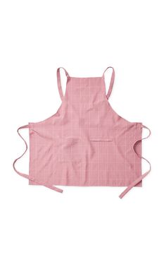 a pink apron with straps on the front and side, showing an adjustable neckline