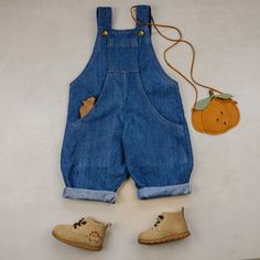 Link to youtube sew along: https://youtu.be/3LuTBEfIaxY Sizes: 12 MONTHS TO 14 YEARS Formats: A4/Letter, A0 and Projector Fabric: Medium weight woven Skill level: Intermediate Classic dungarees (or pinafore) features adjustable straps, an oversized fit, and convenient side and top pockets. All openings are finished with a single folded hem. Diy Dungarees, Dungaree Pattern, Kids Dungarees, Bib Dress, Kids Sewing, Jumper Patterns, Fabric Medium, Photo Tutorial, Sewing For Kids