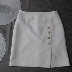 Beautiful Ivory Formal,Linea Fully Lined Skirt Button Detail On Front Tag Says 10,But Is Size 6 No Tags But Never Worn.Bundle To Save I Have Many Items For $10.00 Or Less. Elegant High Waist Pencil Skirt With Buttons, Elegant Mini Skirt With Buttons, Elegant White Skirt With Buttons, Fitted High-waist Mini Skirt With Buttons, Fitted High Waist Mini Skirt With Buttons, Fitted High Waist Button Mini Skirt, Fitted High Waist Skirt With Side Buttons, Mini Skirt With Side Buttons For Work, Chic Fitted Skirt With Side Buttons