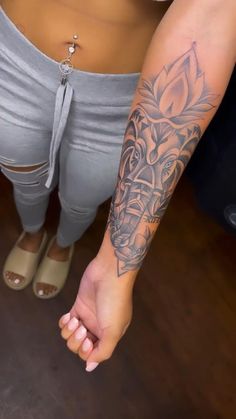 a woman with a tattoo on her arm